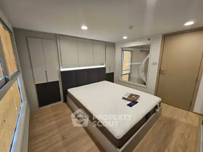 Modern bedroom with minimalist design and ample natural light