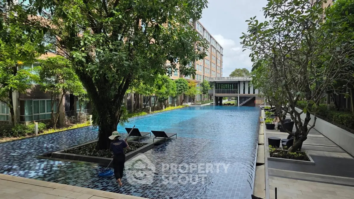 Luxurious residential pool area with lush greenery and modern design