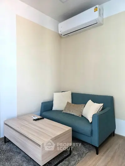 Cozy living room with modern sofa and air conditioning unit