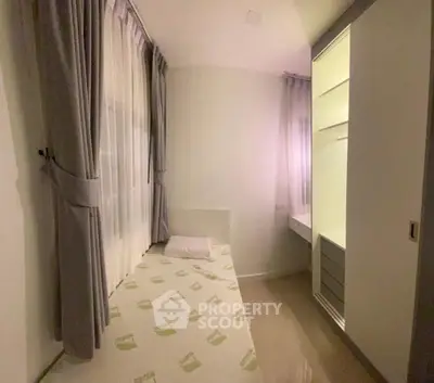 Cozy minimalist bedroom with built-in wardrobe and soft lighting