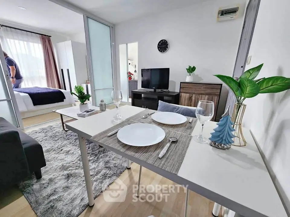 Modern open-plan living and dining area with stylish decor and natural light.