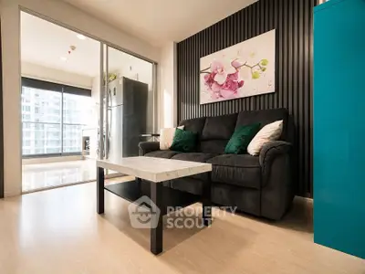 Modern living room with stylish decor and open layout, featuring a comfortable sofa and elegant coffee table.