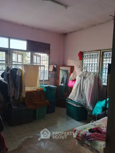 Spacious bedroom with ample storage and natural light, ideal for organizing and relaxing.