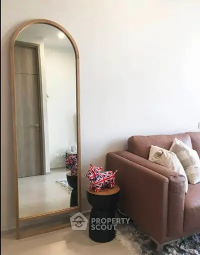 Stylish living room with modern decor and full-length mirror