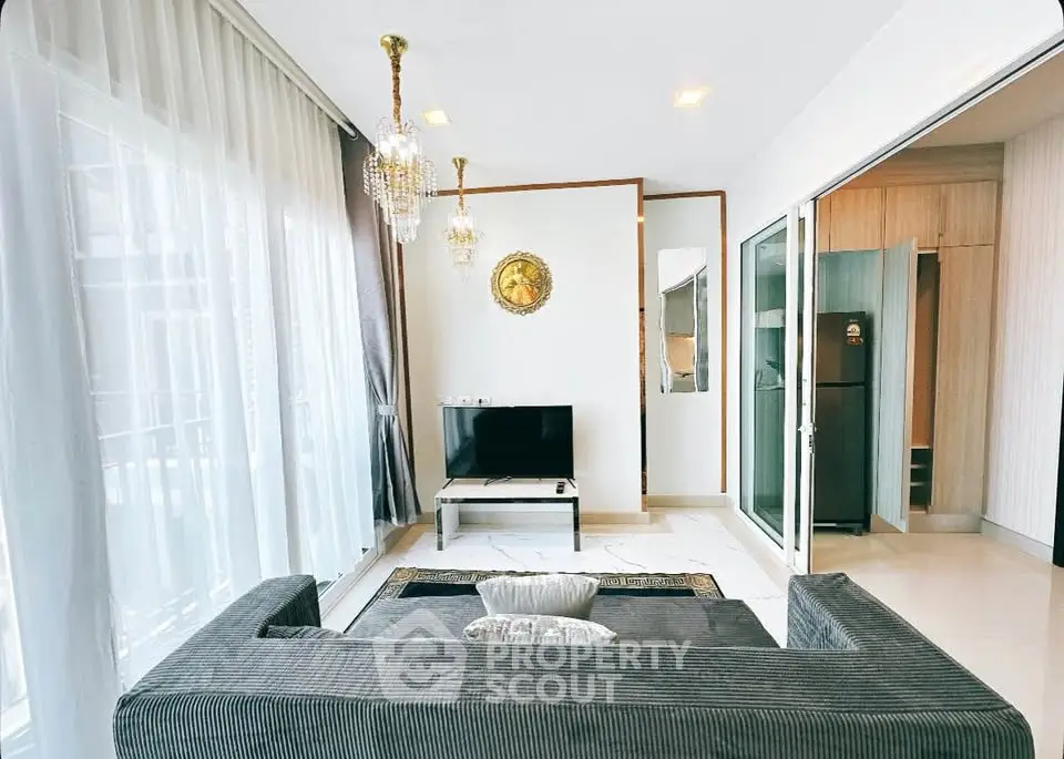 Elegant living room with modern decor and large windows for natural light.