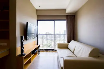 Modern living room with city view and sleek furniture