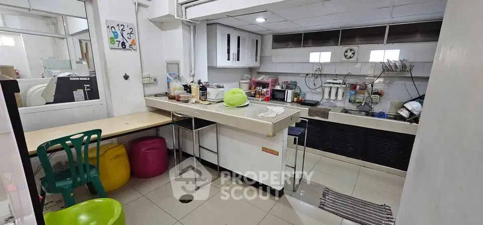 Cozy kitchen with open layout and modern appliances, perfect for culinary enthusiasts.