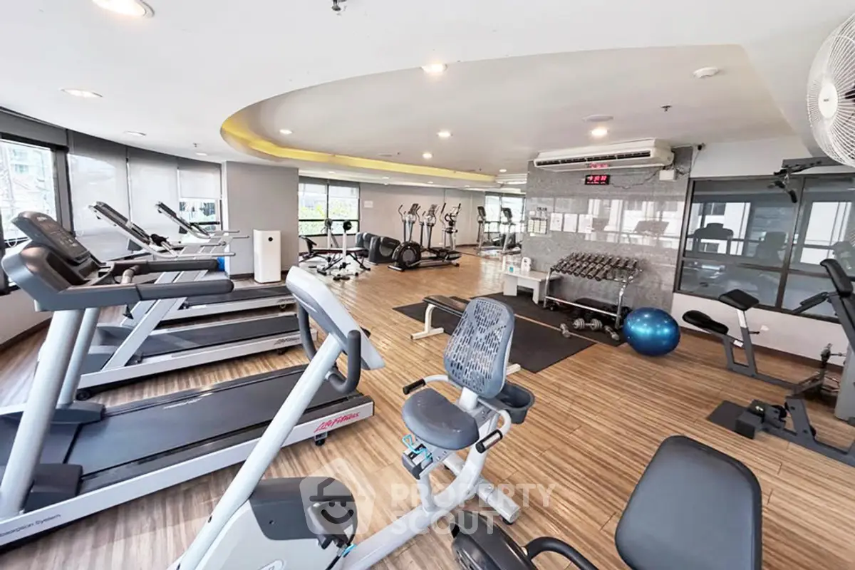 Spacious modern gym with state-of-the-art equipment and stylish design