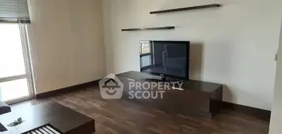 Modern living room with sleek TV stand and floating shelves