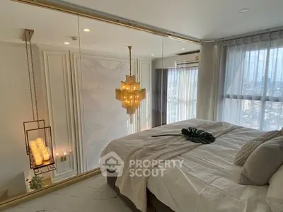 Luxurious bedroom with elegant chandelier and large window view