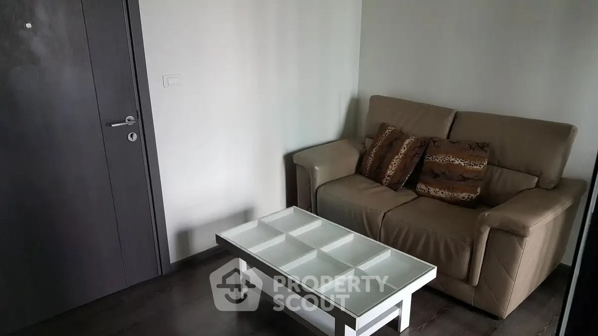 Cozy living room with modern sofa and stylish coffee table in a contemporary apartment.
