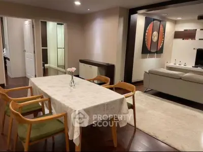 Spacious living and dining area with modern decor and wooden flooring