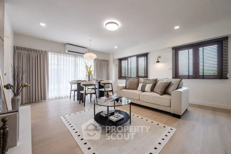 Spacious modern living room with elegant decor and natural light