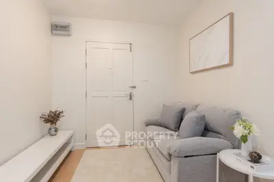 Cozy living room with modern gray sofa and minimalist decor