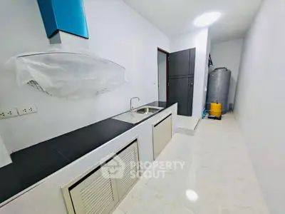 Modern kitchen with sleek countertops and ample storage space