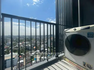 High-rise balcony with city view and washing machine, perfect for urban living.