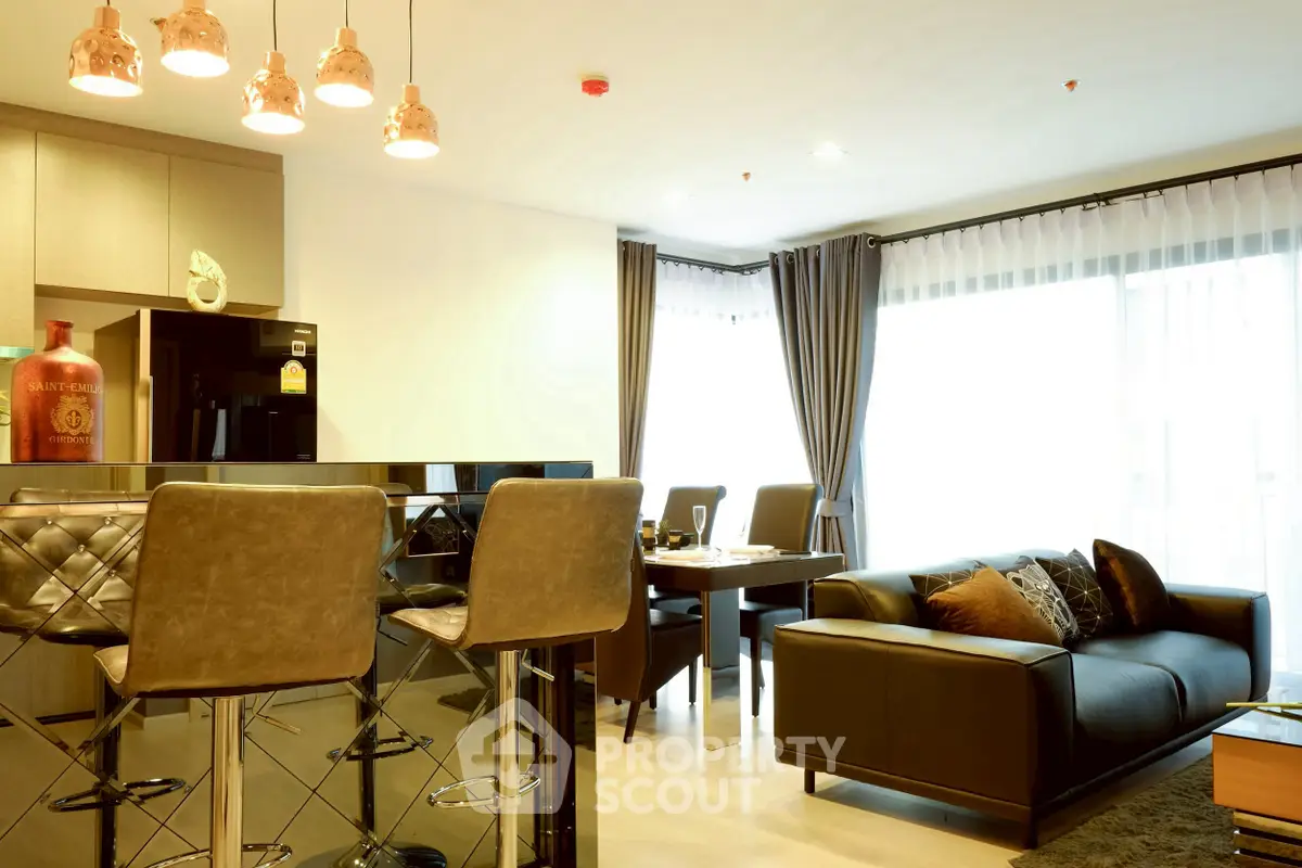 Luxurious modern living room with open kitchen and stylish decor