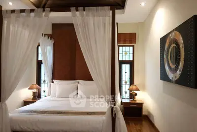 Luxurious bedroom with elegant canopy bed and stylish decor
