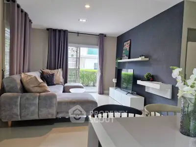 Modern living room with stylish decor and large windows for natural light