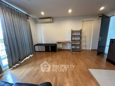 Spacious living room with wooden flooring and modern decor