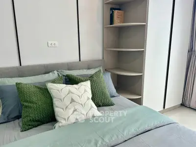 Modern bedroom with stylish decor and cozy bedding