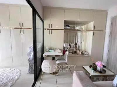 Modern living room with sleek cabinetry and elegant decor