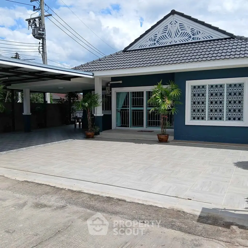 Charming single-story home with spacious driveway and elegant facade, perfect for modern living.