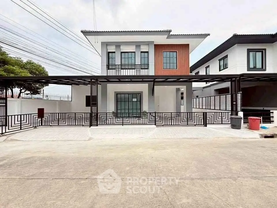 Modern two-story house with stylish facade and spacious driveway
