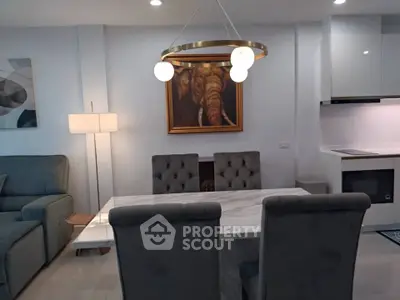 Modern living room with elegant dining area and stylish decor
