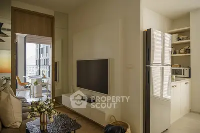 Modern living room with sleek TV setup and open kitchen in stylish apartment