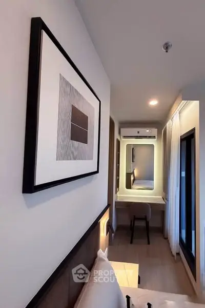 Modern bedroom with stylish decor and natural light