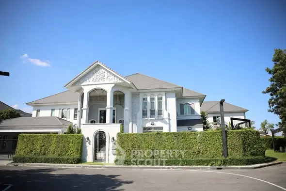 Luxurious modern mansion with elegant architecture and lush greenery, perfect for upscale living.