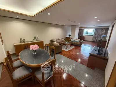 Spacious living room with elegant dining area and stylish decor
