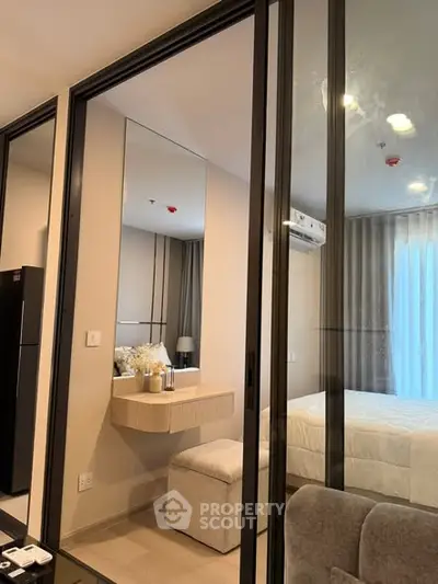 Modern bedroom with glass partition and cozy decor