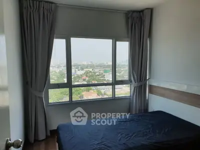 Cozy bedroom with panoramic city view and large windows