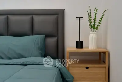 Modern bedroom with stylish headboard and sleek nightstand
