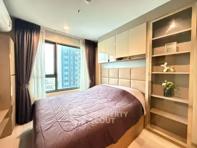 Modern bedroom with large window and stylish decor in urban apartment