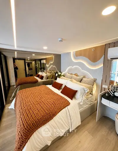 Luxurious modern bedroom with stylish decor and cozy ambiance, featuring elegant lighting and plush bedding.