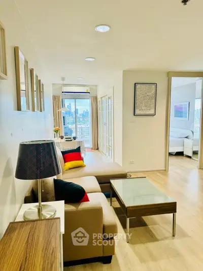 Modern living room with city view and stylish decor in a bright apartment.