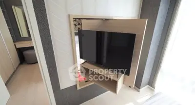 Modern bedroom with sleek TV setup and stylish decor