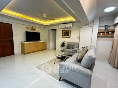 Spacious living room with modern decor and ambient lighting