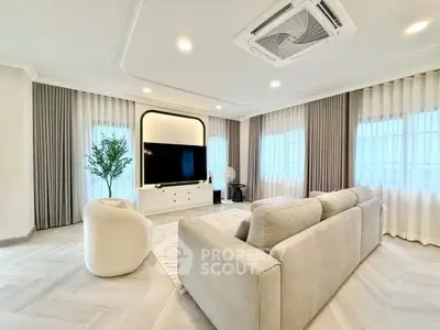 Spacious modern living room with elegant decor and large windows