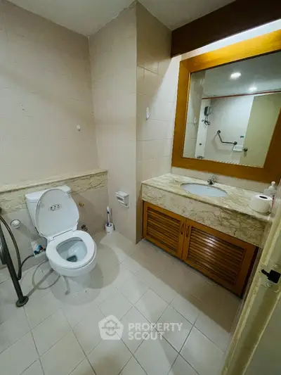 Modern bathroom with elegant marble countertop and spacious layout
