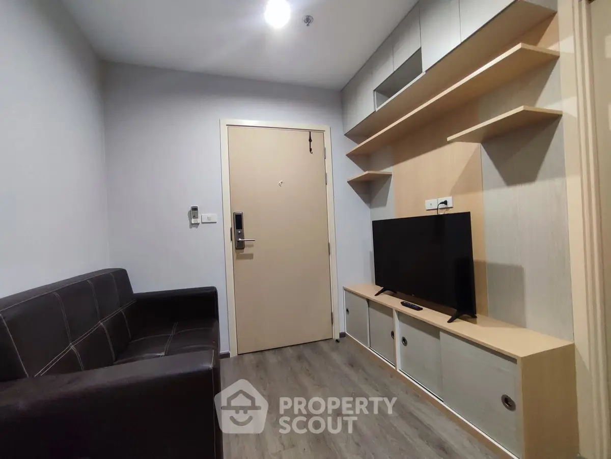Modern living room with sleek furniture and built-in storage, perfect for urban living.