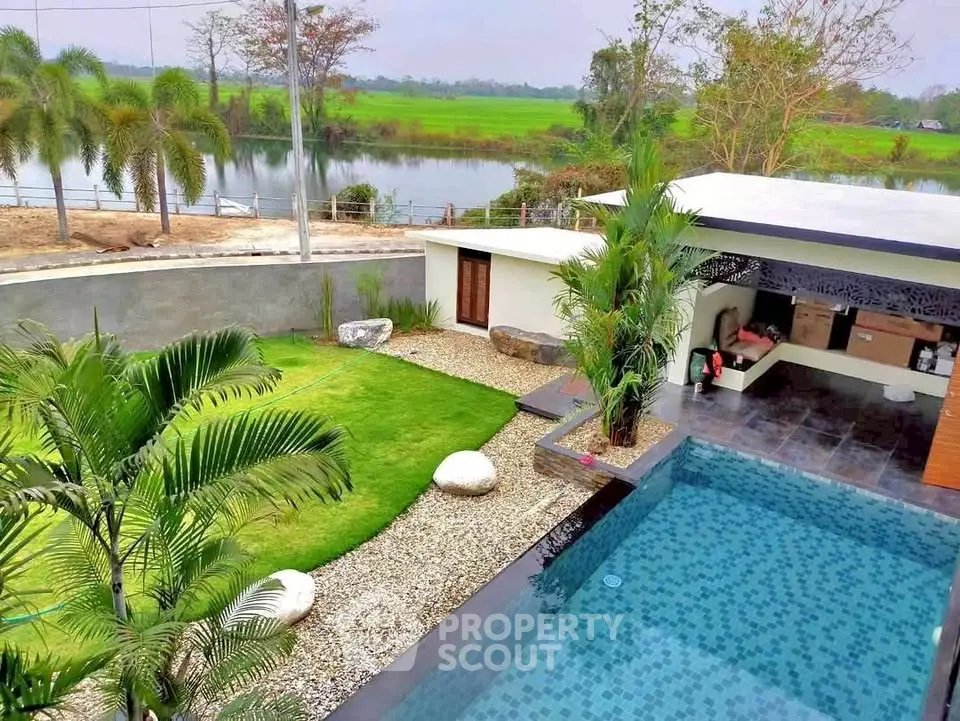 Luxurious modern villa with private pool and lush garden overlooking serene countryside views.