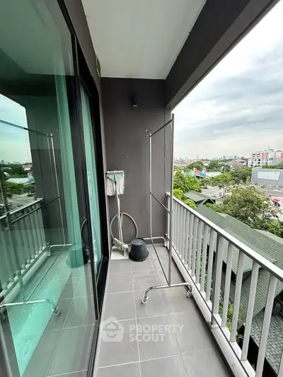 Charming balcony with city view, perfect for relaxation and enjoying the skyline.