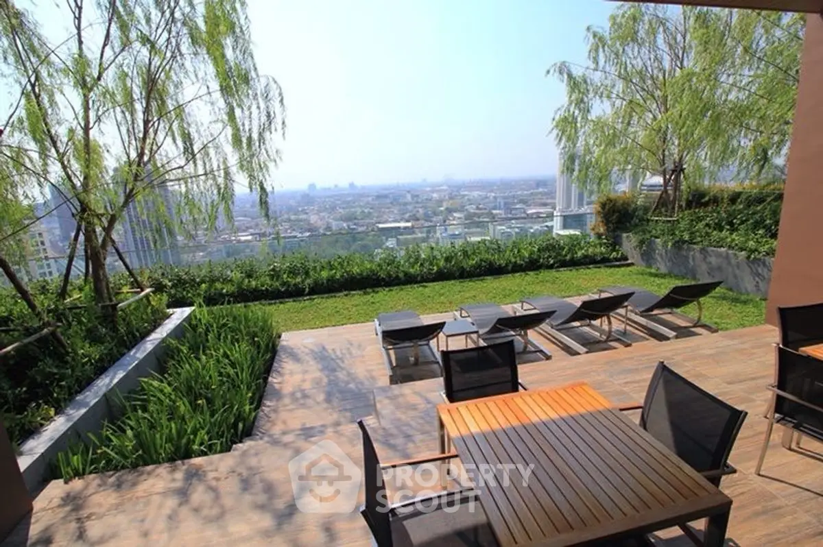 Stunning rooftop garden with panoramic city views and stylish outdoor seating.