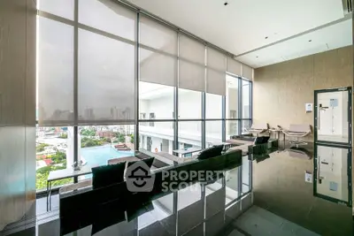 Luxurious modern living room with panoramic city view and sleek design.