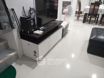 Modern living room with sleek TV stand and comfortable seating