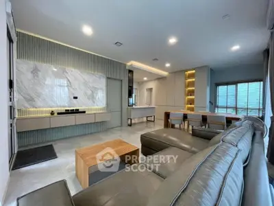 Spacious modern living room with elegant marble accents and open layout
